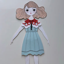 Load image into Gallery viewer, close up of the paper doll with pink hair and a blue dress
