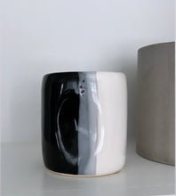 Load image into Gallery viewer, Shiny black, white, and grey Alex Marshall tumbler on a shelf
