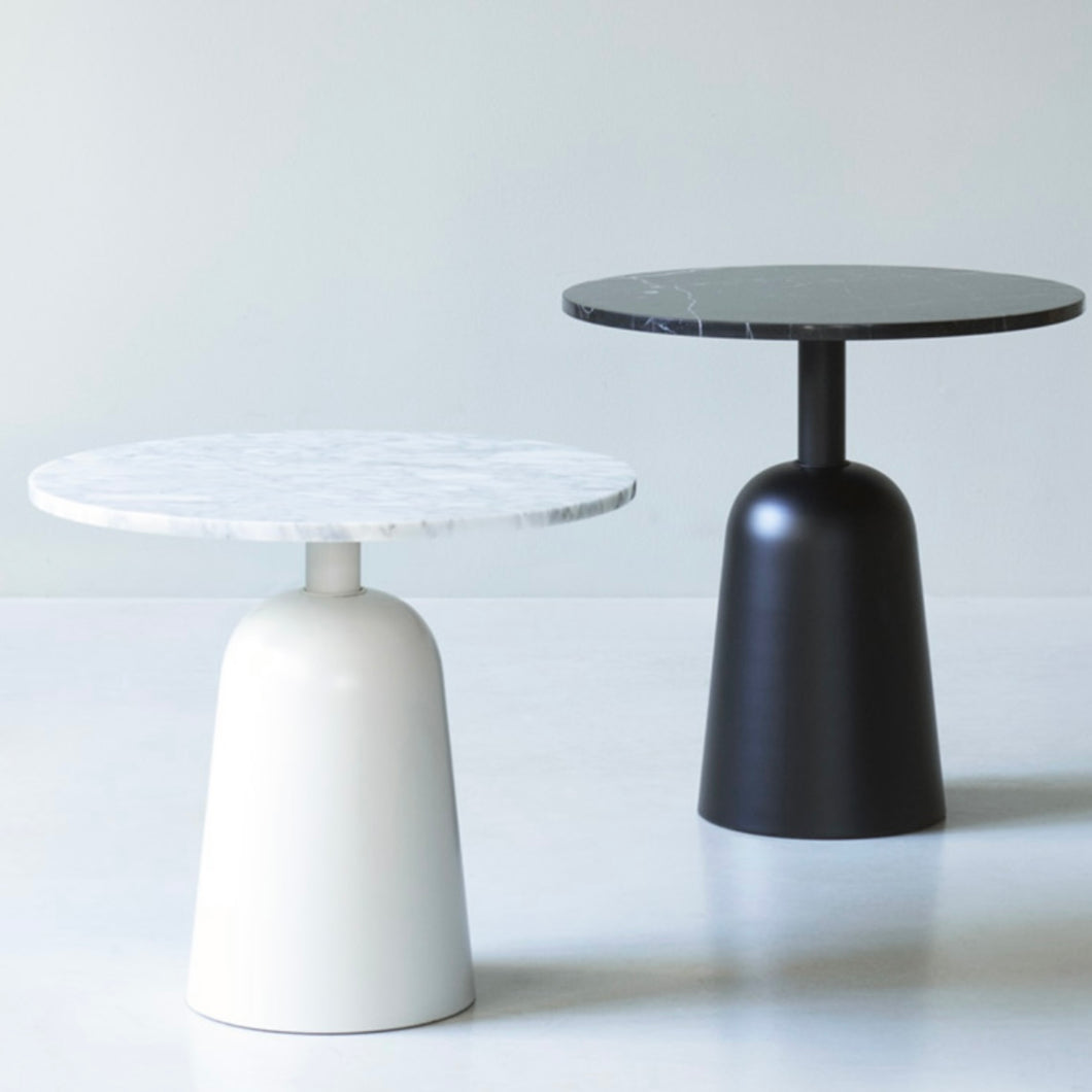 two marble turn tables (black and white) next to one another