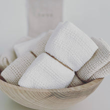 Load image into Gallery viewer, cotton kitchen towels wrapped in twine in a wooden bowl on a white counter
