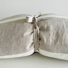 Load image into Gallery viewer, Oatmeal colored pillow rolled up with a ribbon
