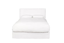Load image into Gallery viewer, White bed in a white room with the white linen sheets and comforter
