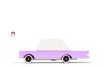 Load image into Gallery viewer, Pink and white wooden toy car by candylab on a white surface
