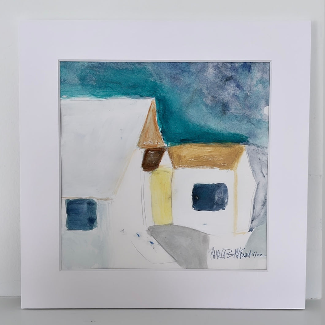 House print with a white mat on a shelf