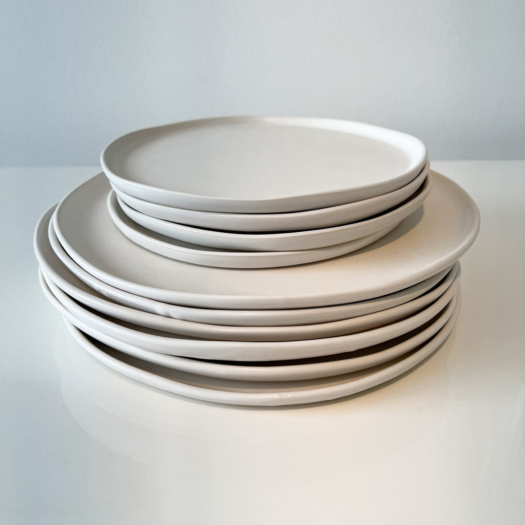small and large plates on a table