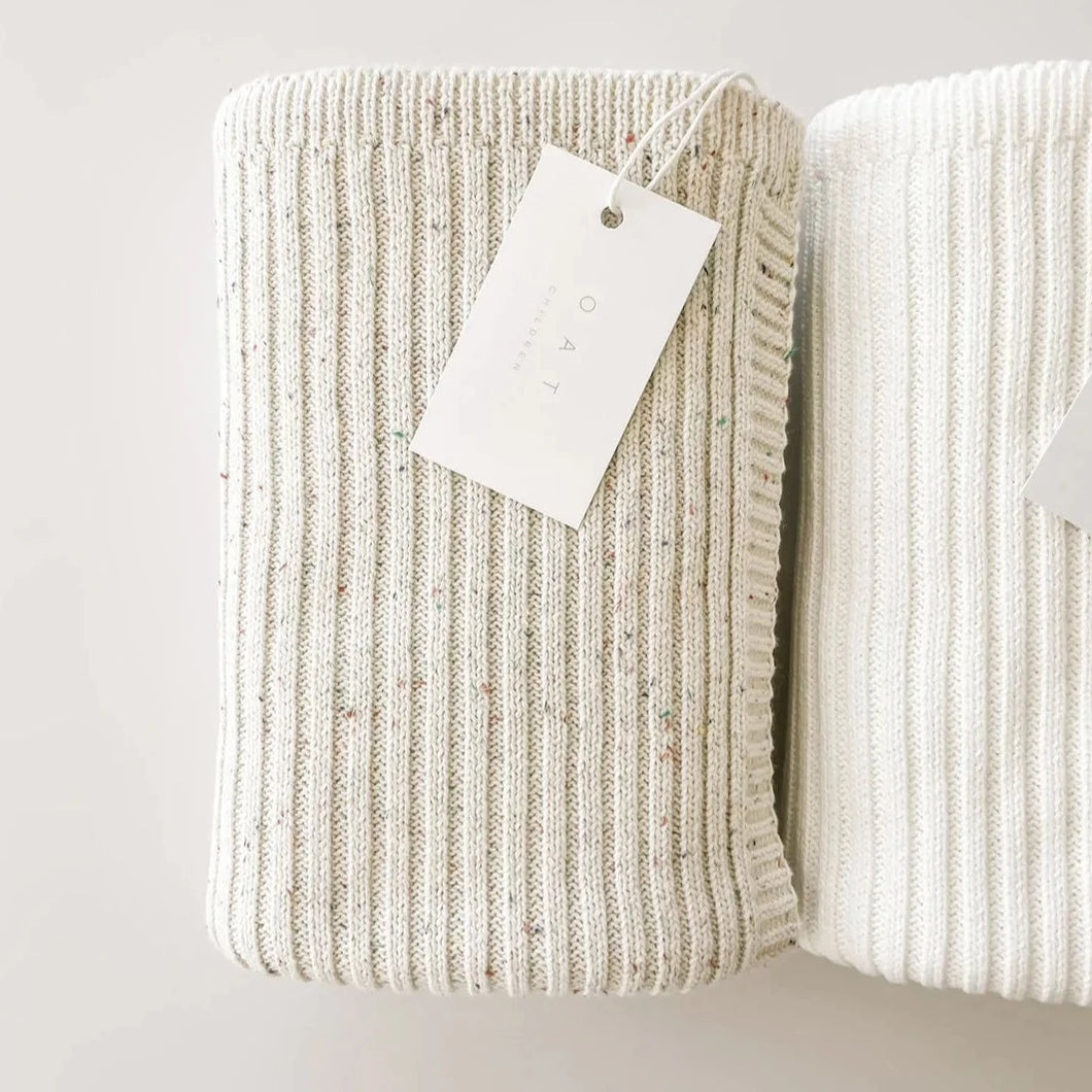 both the sprinkle and ivory blanket rolled up