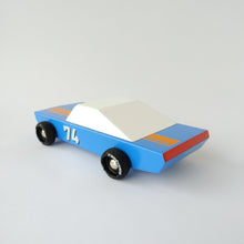Load image into Gallery viewer, A photo of the back angle of a blue stockcar, white top, black wheels, number 74 on the door.
