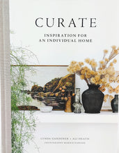 Load image into Gallery viewer, Front cover of book titled Curate, Cover has artwork, vases, vase with flowers, sitting on a mantle with green plant on side.
