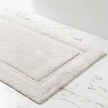 Load image into Gallery viewer, White rectangle bath mat on a marble floor
