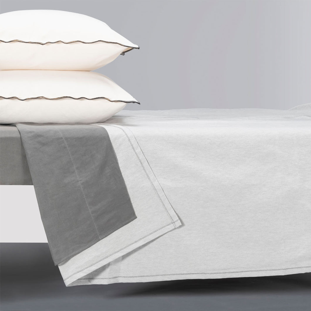 oatmeal coverlet on a bed