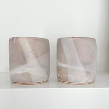 Load image into Gallery viewer, Muted pink and white Alex Marshall tumbler on a white shelf
