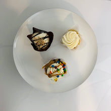 Load image into Gallery viewer, birds eye view of the black and white cake stand with three cupcakes on it 
