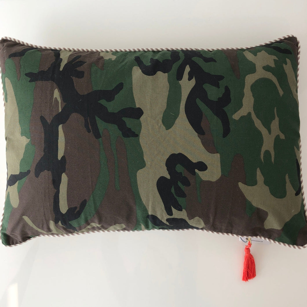 green camo lumbar pillow on a white background