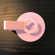 Load image into Gallery viewer, pink candle holder from the top on a wooden shelf
