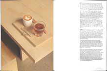 Load image into Gallery viewer, Page in the book with a cup of coffee
