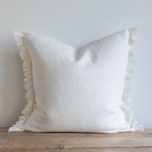 Load image into Gallery viewer, White frayed pillow on a wooden bench
