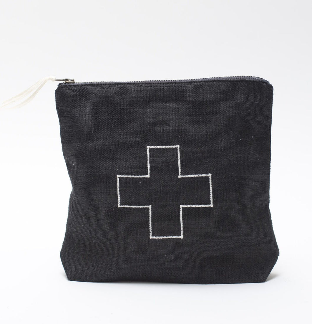 black linen bag with a white plus in the middle