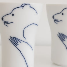 Load image into Gallery viewer, Two porcelain Hering Berlin drinking glasses with blue bear sketch on the side. 
